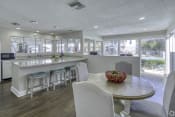 Thumbnail 7 of 16 - a kitchen and dining area with a table and chairs at Beach Club, Tampa, FL, 33614