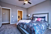 Thumbnail 8 of 33 - a bedroom with a bed and a ceiling fan at Park 33, Goshen, IN 46526
