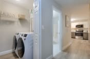 Thumbnail 8 of 8 - a washer and dryer in a laundry room