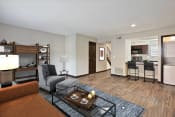 Thumbnail 3 of 29 - Living Room With Kitchen View at Artesian East Village in Atlanta