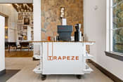 Thumbnail 27 of 39 - a coffee cart in the lobby of a coffee shop with a coffee machine on it