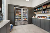 Thumbnail 32 of 39 - the pantry in the clubhouse has a large refrigerator and plenty of food