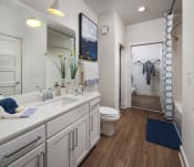Thumbnail 4 of 34 - Relax in your Stunning Bathroom with Double Vanity Sinks, Subway Tile Showers with Glass Enclosures and Full Length Mirrors at Echo at North Pointe Center Apartment Homes, Alpharetta, GA 30009