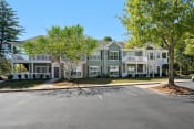 Thumbnail 32 of 33 - Exterior with Lush Landscaping and large patios located at St. Andrews Apartments in Johns Creek, GA 30022