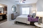Thumbnail 7 of 33 - Main Bedroom with Ceiling Fan and Large Windows  located at Retreat at Steeplechase in Houston, TX 77065