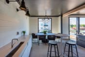 Thumbnail 4 of 31 - a kitchen and dining area in a 555 waverly unit at The Livano Tryon, Charlotte, NC, 28213
