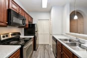 Thumbnail 2 of 18 - Upgraded kitchen with stainless steel appliances at The Finley, Jacksonville, FL  32210