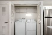 Thumbnail 14 of 34 - In-unit washer and dryer inside a closet with shelf storage