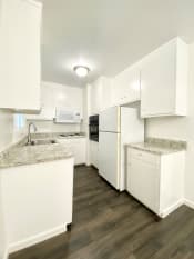 Thumbnail 14 of 30 - Kitchen With White Cabinetry And Appliances at 2120 Valerga Drive Belmont, California, 94002
