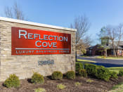 Thumbnail 24 of 24 - Property signage at Reflection Cove Apartments in Manchester, Missouri