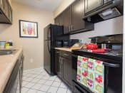 Thumbnail 3 of 24 - Updated Kitchen With Black Appliances at Reflection Cove Apartments in Missouri, 63021
