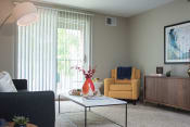 Thumbnail 2 of 19 - Living Room With Expansive Window at The Pointe at St. Joseph Apartments, Indiana, 46617