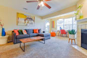 Thumbnail 1 of 29 - a living room with a couch coffee table and fireplace at Riverset Apartments in Mud Island, Memphis, TN