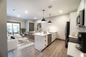 Thumbnail 1 of 52 - a kitchen and living room in an apartment at The Commons at Rivertown, Grandville, 49418
