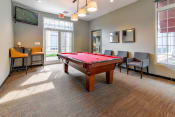 Thumbnail 23 of 29 - our apartments have a game room with a pool table and a flat screen tv at Riverset Apartments in Mud Island, Memphis, TN