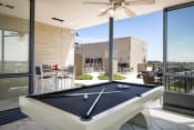 Thumbnail 19 of 26 - a pool table in the patio of a home with a roof terrace
