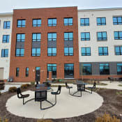Thumbnail 6 of 52 - Apartment building exterior and outdoor seating area-Beecher Terrace I, Louisville, KY