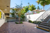 Thumbnail 8 of 16 - Outdoor breezeway area at Mission Plaza Apartments, Los Angeles, CA