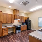 Thumbnail 2 of 14 - Community room kitchen, Wheatley Park Senior Apartments San Antonio, TX