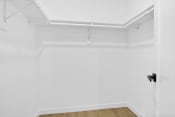 Thumbnail 8 of 12 - an empty room with white walls and a black door