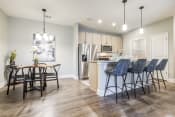 Thumbnail 1 of 23 - a kitchen and dining area in a 555 waverly unit