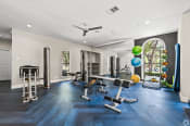Thumbnail 27 of 52 - a home gym with exercise equipment and a large window