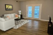 Thumbnail 6 of 19 - a living room with hardwood floors