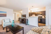 Thumbnail 2 of 12 - Open living room kitchen and dining area at Brook View Apartments, Baltimore, Maryland