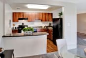 Thumbnail 1 of 16 - Dining Room with Open Kitchen at Kenilworth at Charles Apartments, Maryland