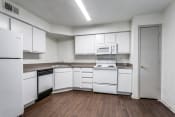 Thumbnail 5 of 13 - a kitchen with white cabinets and white appliances