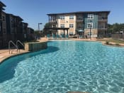 Thumbnail 21 of 27 - Invigorating swimming pool with sunning deck at CLEAR Property Management , The Lookout at Comanche Hill, San Antonio, TX, 78247