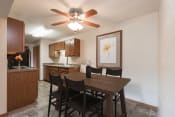 Thumbnail 2 of 6 - Kitchen and Dining Area at Parkview Arms Apartments in Bismarck, ND