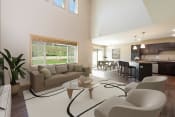 Thumbnail 2 of 11 - Bismarck, ND Stonefield Townhomes. The large room showcases comfortable seating, modern decor, and natural lighting, creating a welcoming and relaxing space for residents.