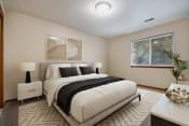 Thumbnail 2 of 10 - Omaha, NE Deerfield Apartments. A bedroom with a bed and two windows
