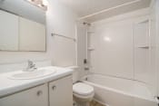 Thumbnail 9 of 9 - Omaha, NE Evergreen Terrace Apartments. bathroom with a sink toilet and bathtub