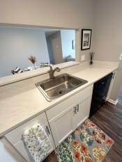 Thumbnail 3 of 50 - a kitchen with a sink and a mirrorat Centerpointe Apartments, Canandaigua, 14424
