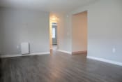 Thumbnail 18 of 79 - an empty living room with wood floors and white walls at Willowbrooke Apartments, New York