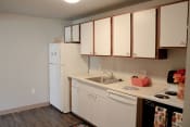 Thumbnail 5 of 79 - a kitchen with white cabinets and a sink and a refrigerator at Willowbrooke Apartments, Brockport, 14420