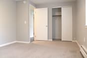 Thumbnail 22 of 79 - an empty room with a closet and a door to a closet at Willowbrooke Apartments, Brockport, NY