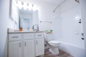Thumbnail 9 of 36 - a white bathroom with a toilet and a sink