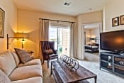 Thumbnail 6 of 23 - a living room with a couch and a tv  at Aventura at Mid Rivers, St. Charles, MO