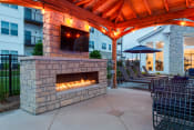Thumbnail 4 of 18 - our outdoor fireplace is the focal point of our patio  at The Edison at Tiffany Springs, Missouri, 64153