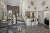 Thumbnail 10 of 58 - a kitchen and living room with a staircase leading up to the second floor  at Vesper, Dallas, TX