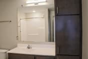 Thumbnail 41 of 54 - a bathroom with a sink and a mirror
