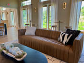 Thumbnail 40 of 51 - a living room with a brown couch and a blue coffee table at Delco Flats, Austin