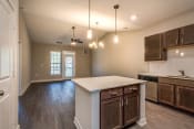 Thumbnail 38 of 65 - Kitchen & Living Room (Premier Floor Plan) at Emerald Creek Apartments, Greenville