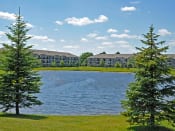 Thumbnail 2 of 33 - Lake with Green Surroundings at Prairie Lakes Apartments, Peoria, Illinois