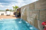 Thumbnail 9 of 22 - Waterfalls in the pool at the Residences of Creekside.