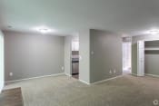 Thumbnail 2 of 16 - Dining room with gray walls and plush carpeting