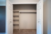 Thumbnail 8 of 17 - Large closet with shelving and bifold doors